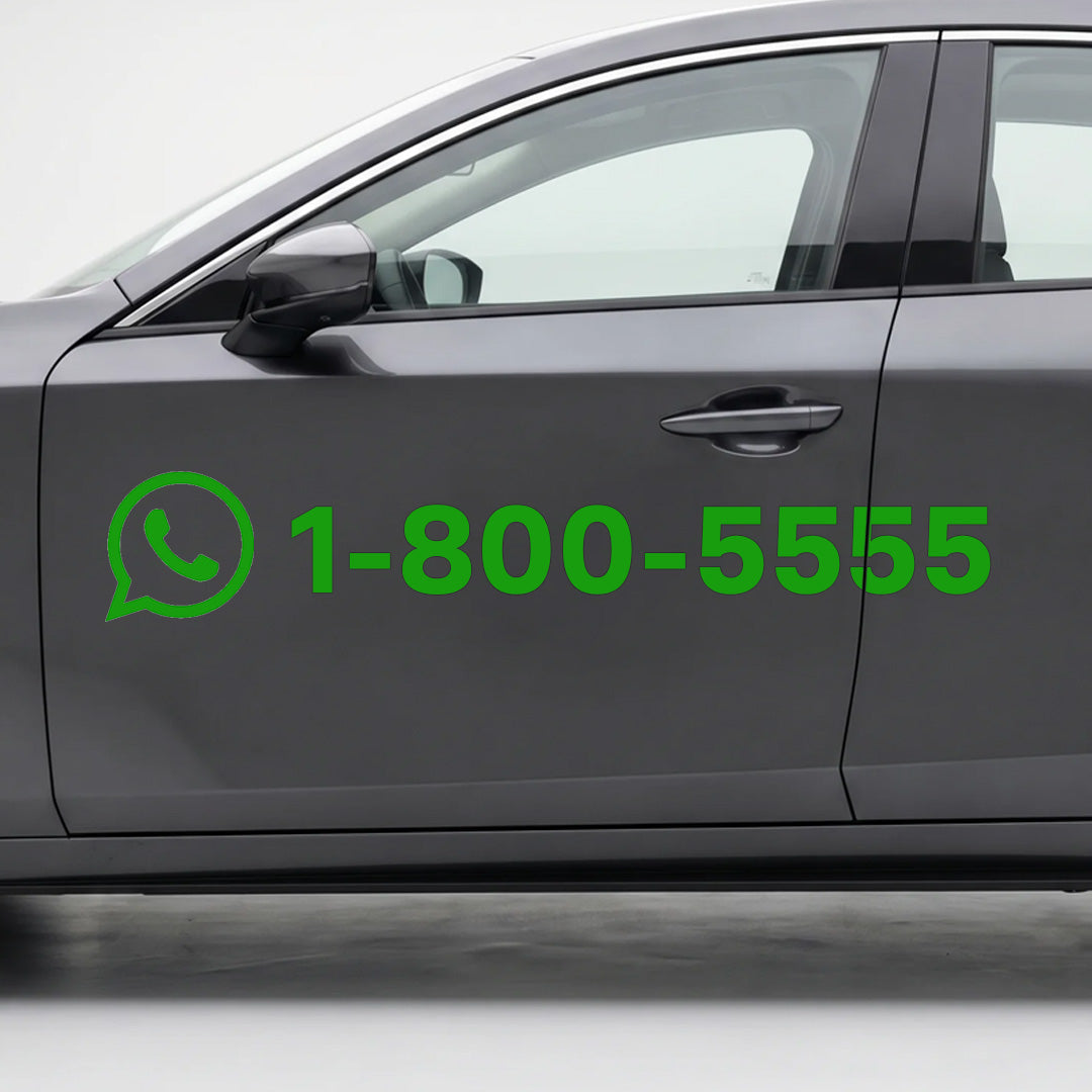 Car door with WhatsApp logo and phone number decal on a gray background